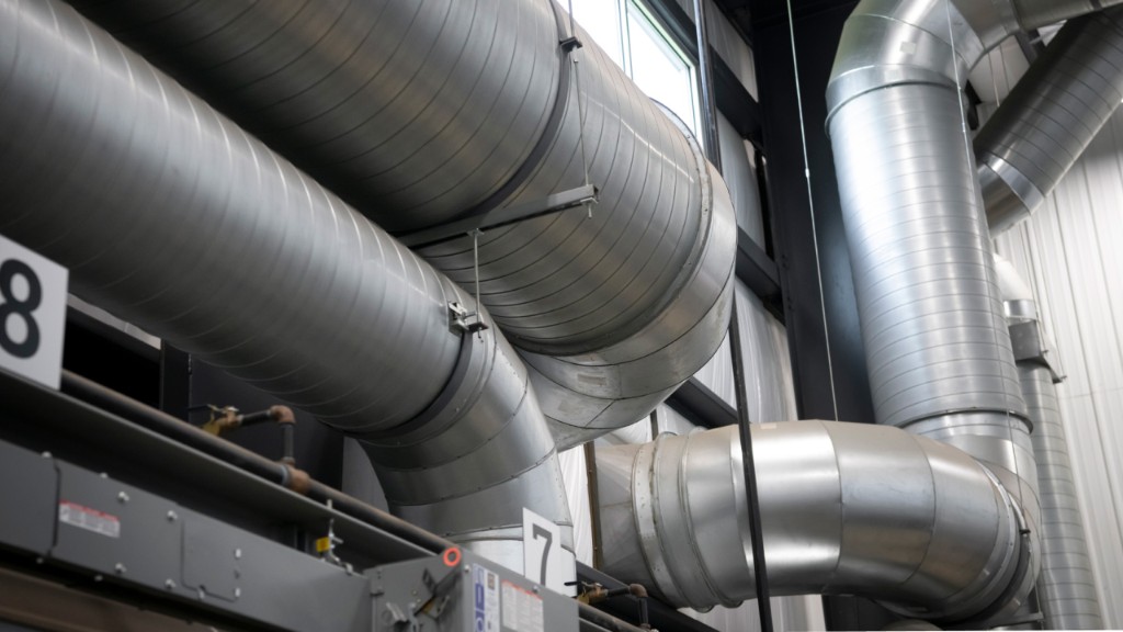 Large industrial HVAC ductwork in a commercial building.